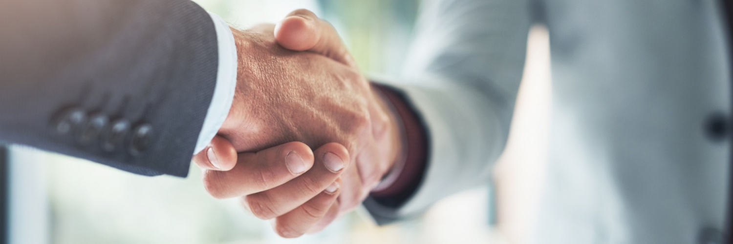 Two people shaking hands.