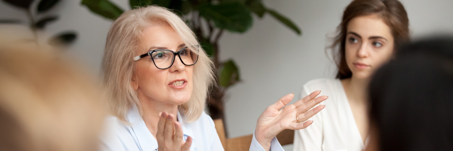 A woman talking during a work meeting.